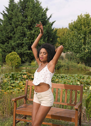 1 dark haired female tortures another during lezdom play in concrete cellar